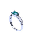 0.90 ct. east west emerald ring in 14k white gold with side diamonds.