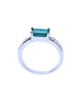 East West emerald ring with a vivid green emerald and diamond accents on a 14k white gold band.