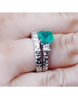 1.48 ct. emerald engagement ring and matching diamond wedding band set in 14K white gold.