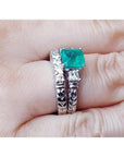 1.48 ct. emerald engagement ring and matching diamond wedding band set in 14K white gold.