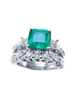 A Muzo Colombian emerald ring with a diamond matching band set in white gold.
