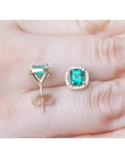1.55 carat emerald halo diamond stud earrings in 14K yellow gold, one front view, one back view.