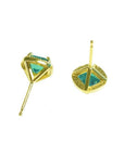 Pair of 1.55 carat emerald stud earrings with halo diamonds set in 14K yellow gold.