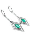 Pair of 14k white gold colombian emerald marquise earrings with lever backs.