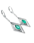Pair of 14k white gold colombian emerald marquise earrings with lever backs.