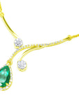 Emerald necklace for women sourced from the Muzo mines in Colombia a natural pear cut 2.96 carats, halo diamond set in 18k yellow gold