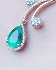Emerald and natural diamond necklace a natural pear cut 2.96 carats, encircled by a halo diamond set in 18k yellow gold