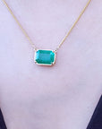 Muzo Colombia Emerald necklace for sale 5.52 carats rectangular emerald-cut, set in a handcrafted 18k yellow gold frame