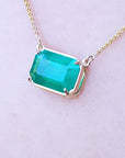 Women's May's birthstone solitaire Emerald necklace natural sourced from the Muzo mine, handcrafted 18k yellow gold frame