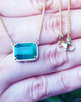 Ladies Solitaire emerald necklace 5.52 carats emerald-cut sourced from the Muzo mine, set in a handcrafted 18k yellow gold frame