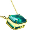 East west Emerald solitaire necklace 5.52 carats emerald-cut natural from the Muzo mine, set in a 18k yellow gold frame