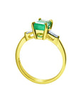 Affordable three stone emerald engagement ring yellow gold