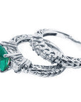 Colombian Emerald engagement ring natural Muzo mine of 1.48 carats, paired with a coordinating diamond wedding band. Both crafted in 14K white gold