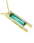 14k yellow gold necklace with a natural colombian emerald gemstone and small lateral diamonds.
