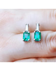 Colombian emerald and baguette diamond stud earrings, 14K white gold.