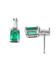 A pair of white gold emerald and baguette diamond earrings, downside gallery and top view.