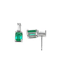 Colombian emerald and baguette diamond stud earrings in 14K white gold.