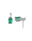 Colombian emerald and baguette diamond stud earrings in 14K white gold.