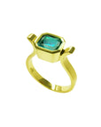 Bezel-set emerald-cut Colombian emerald in a solid 14K yellow gold solitaire ring.