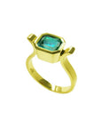 Bezel-set emerald-cut Colombian emerald in a solid 14K yellow gold solitaire ring.