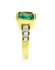 A side position of a Muzo Colombian emerald rings for women, displaying its side profile.