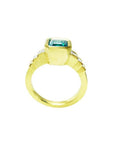 18K gold ring with a 2.10 ct rectangular bluish-green emerald and bezel-set princess-cut diamonds.