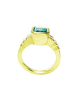 18K gold ring with a 2.10 ct rectangular bluish-green emerald and bezel-set princess-cut diamonds.