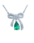 Natural emerald necklace bowtie design pear cut mined in Muzo Colombia, with high quality natural diamonds pave set