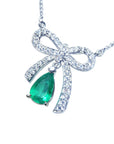 Ladies Natural Emerald bowtie necklace pear cut mined in Muzo Colombia, with high quality natural diamonds pave set