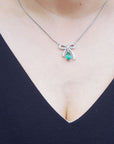 18k White gold emerald bowtie necklace pear cut 1.28 carats mined in Muzo Colombia, with high quality natural diamonds