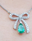 Bow tie Colombian emerald necklace pear cut 1.28 carats mined in Muzo Colombia, with high quality natural diamonds