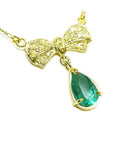 Emerald bowtie necklace natural from Muzo mine in Colombia pear cut, yellow diamonds pave set in 18k yellow gold