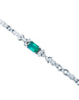 1.08 carat Muzo Colombian emerald bracelet with rectangular deep bluish-green emerald and diamond accents in 14K white gold.