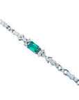 1.08 carat Muzo Colombian emerald bracelet with rectangular deep bluish-green emerald and diamond accents in 14K white gold.