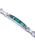White gold bracelet with three rectangular Colombian emeralds and princess-cut diamond accents.