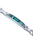 White gold bracelet with three rectangular Colombian emeralds and princess-cut diamond accents.