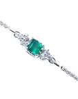 14k white gold bracelet with a square natural colombian emerald and accent diamonds.