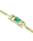 14K yellow gold bracelet with a central emerald-cut Colombian emerald and diamond accents.