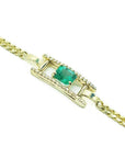 14K yellow gold bracelet with a central emerald-cut Colombian emerald and diamond accents.