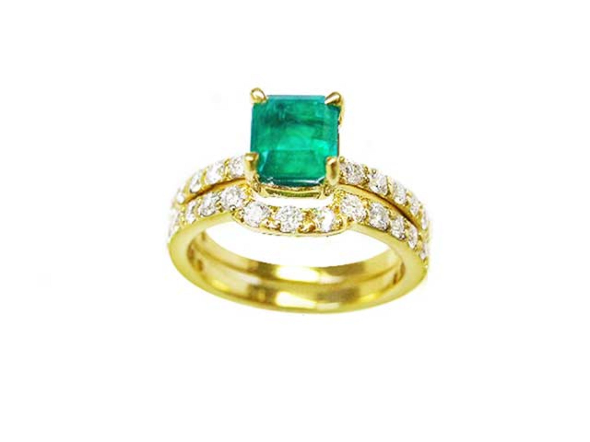 An emerald bridal ring with set matching band topside view.