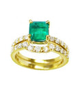 An emerald bridal ring with set matching band topside view.