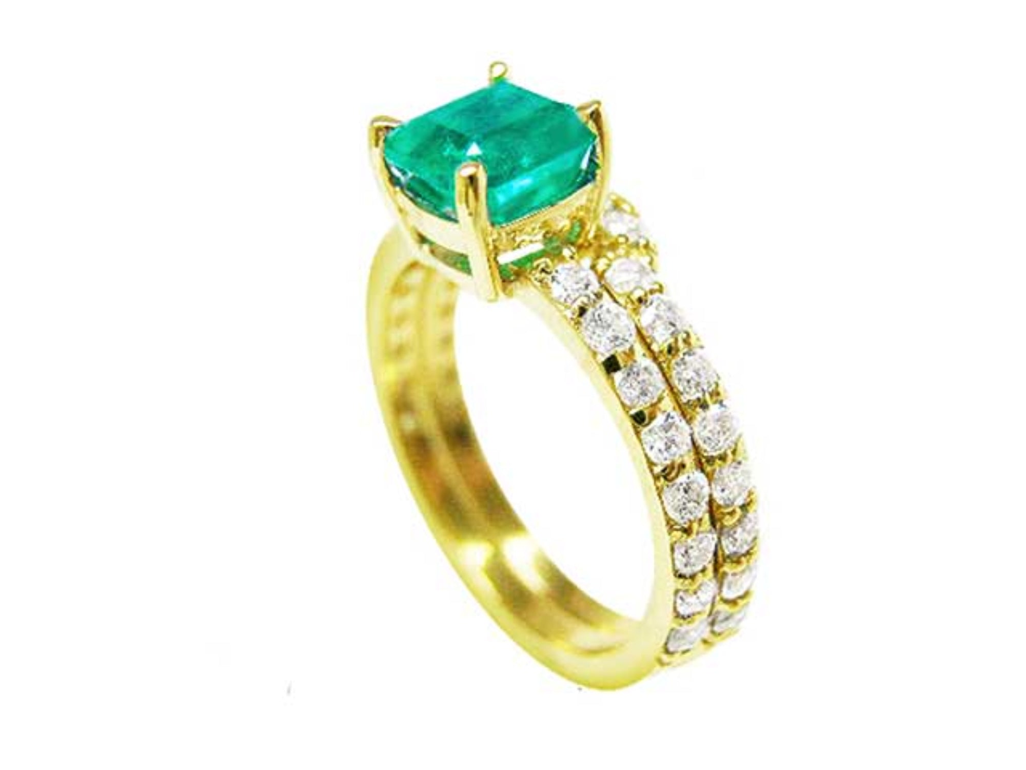 A yellow gold emerald bridal ring with matching band, top and side profile view.