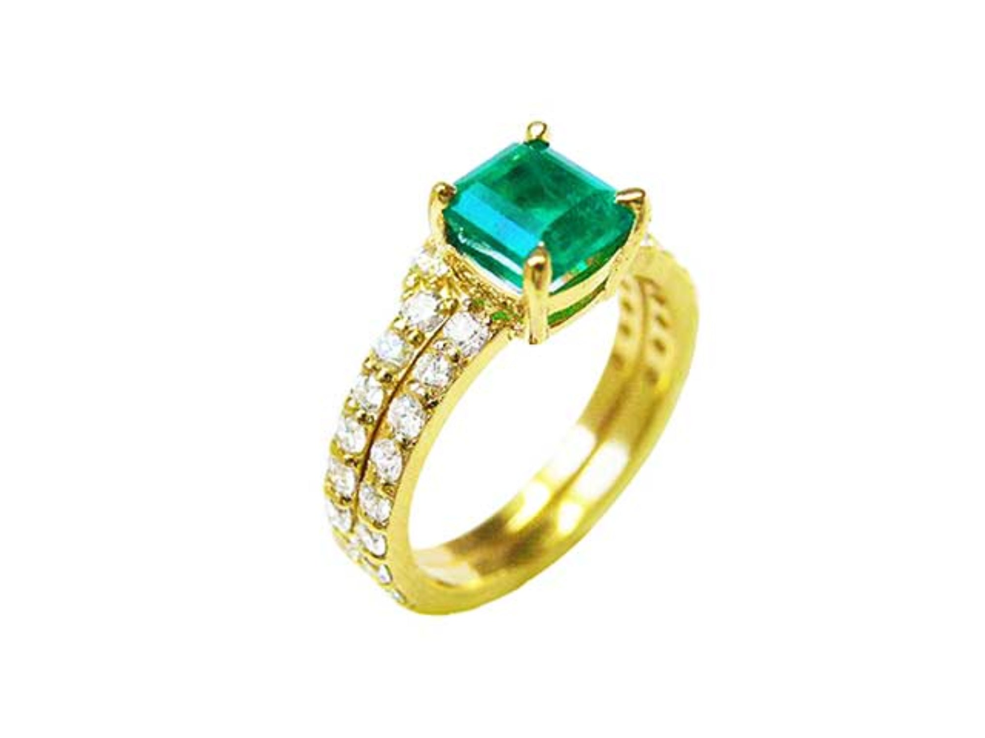 A natural emerald bridal ring with matching band set in yellow gold, top and lateral side profile visibles.