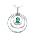 A frontside view of a triple circle of life pendant adorned with natural diamonds, in the center an oval cut colombian emerald.