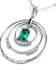 The right-side position of t this triple circle of life emerald pendant shows a closer view of the three rings.