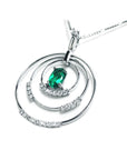The right-side position of t this triple circle of life emerald pendant shows a closer view of the three rings.
