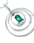The right-side profile view of this circle of life emerald pendant oval cut with natural diamonds in white gold, clearly shows its three circles.