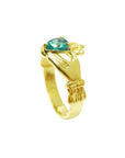 Women's 14K yellow gold Claddagh ring with a pear-shaped Colombian emerald.