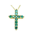 14K yellow gold cross pendant necklace with eleven round-cut Colombian emeralds.
