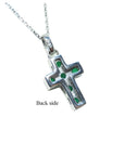 Emerald cross pendant necklace o the back side view.